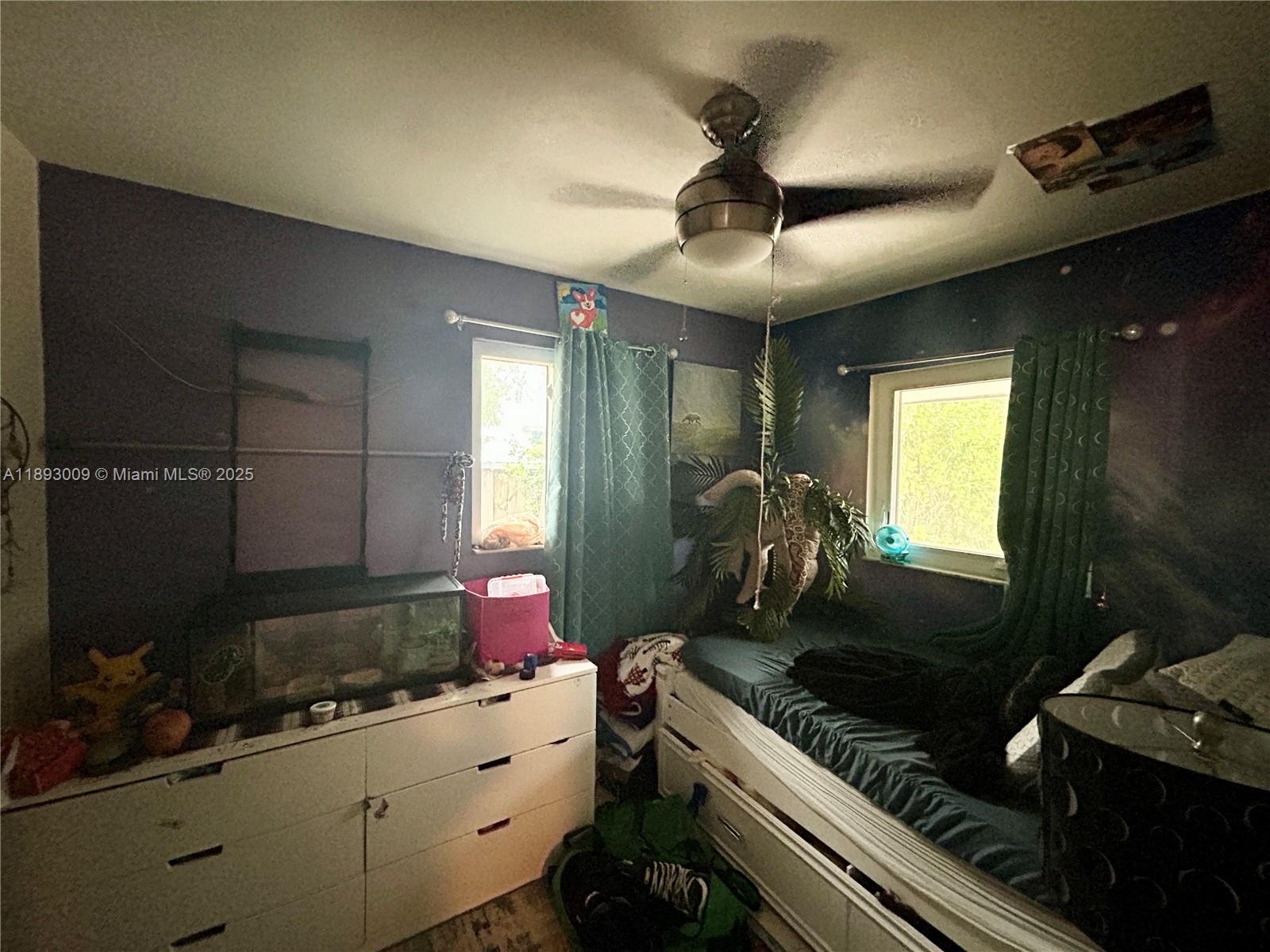 150 Northwest 44th Street Miami, FL 33127 - Photo 9 of 16 a kitchen with a stove and a microwave