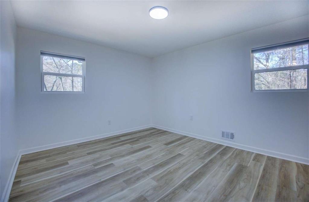 7225 Pineneedle Drive Southwest Covington, GA 30014 - Photo 18 of 37 an empty room with a window