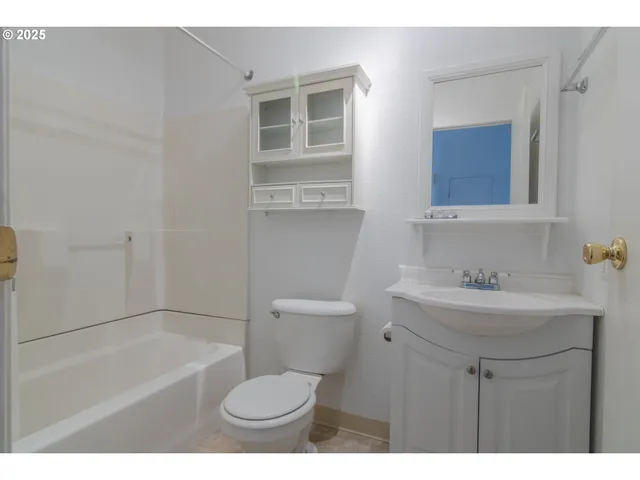 a bathroom with a sink a toilet and a bathtub