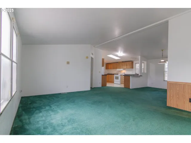 a view of a kitchen with a sink and a window