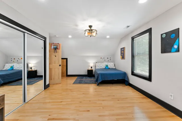 a bedroom with furniture and window