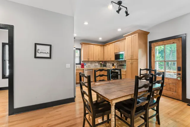 a view of a dining room with furniture window and wooden floor