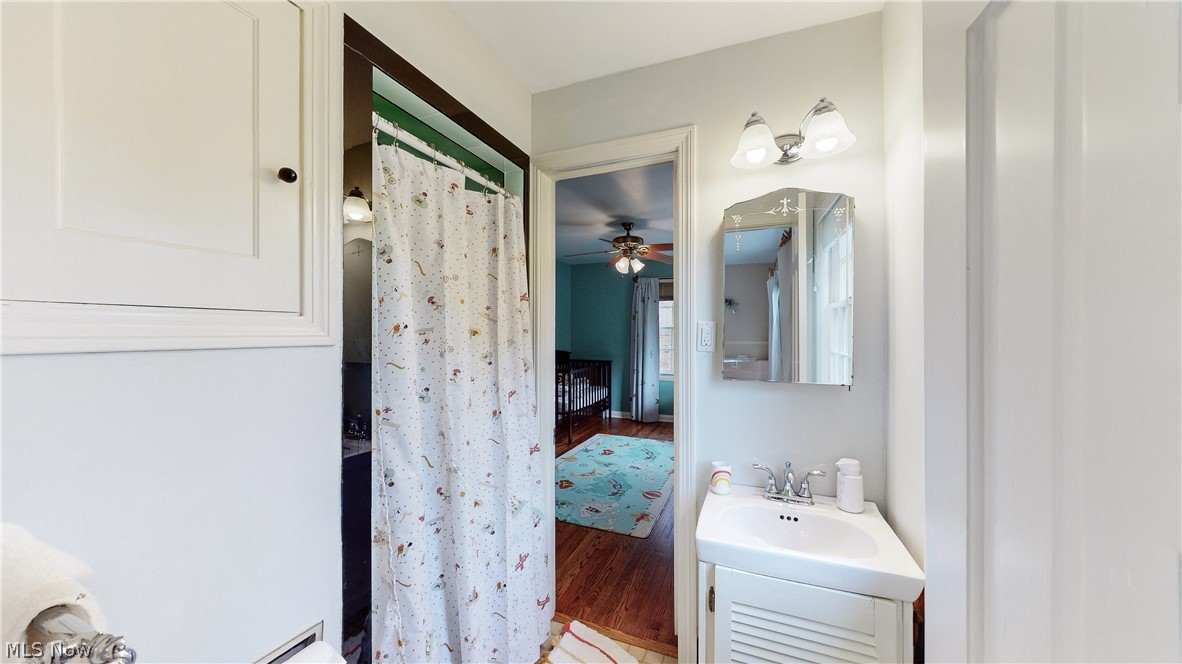 3658 Traver Road Shaker Heights, OH 44122 - Photo 19 of 33 Bathroom featuring ceiling fan, hardwood / wood-style floors, and oversized vanity