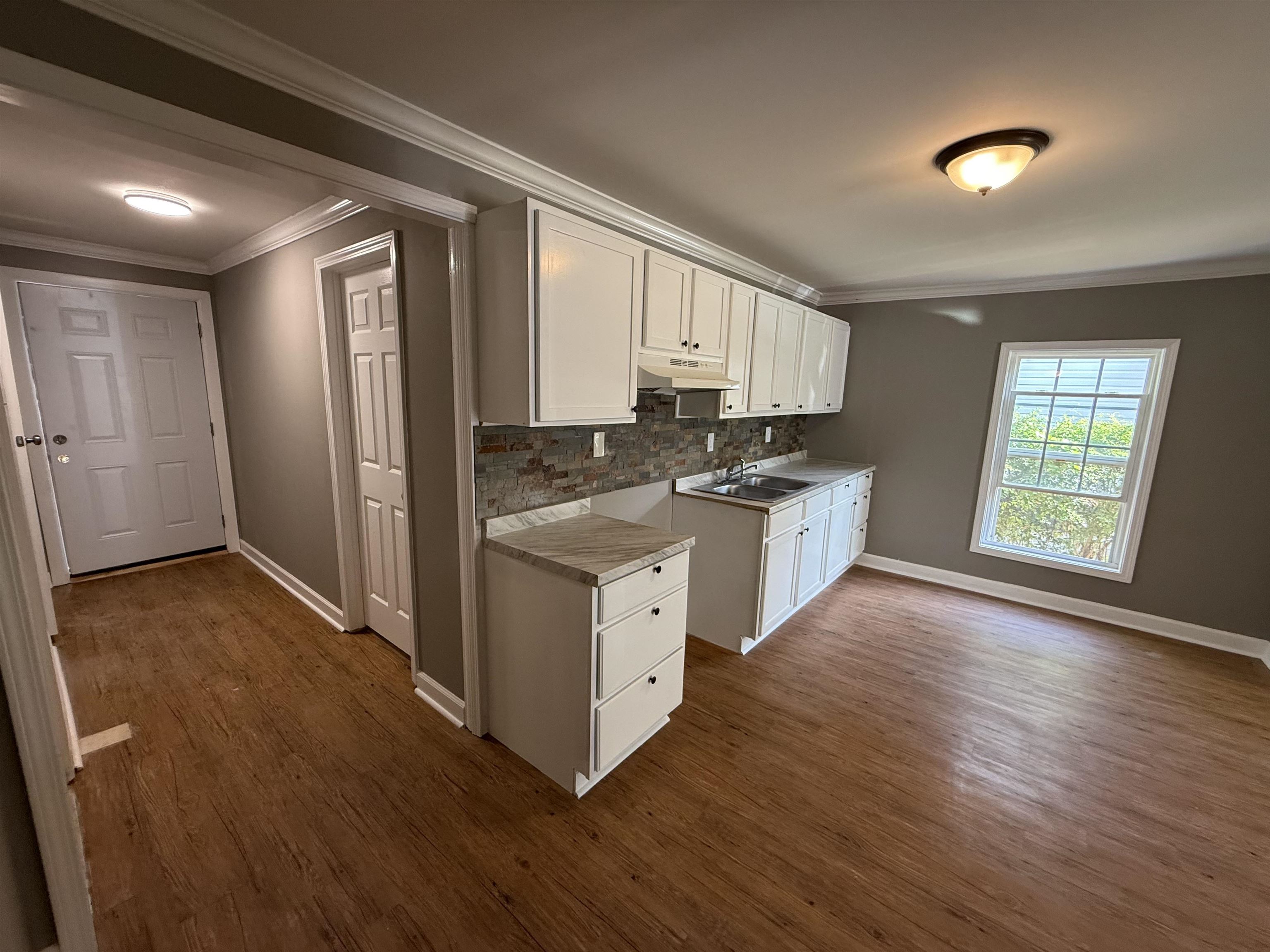304 Harrell Street Memphis, TN 38112 - Photo 3 of 10 a kitchen with stainless steel appliances granite countertop a stove a sink and a refrigerator