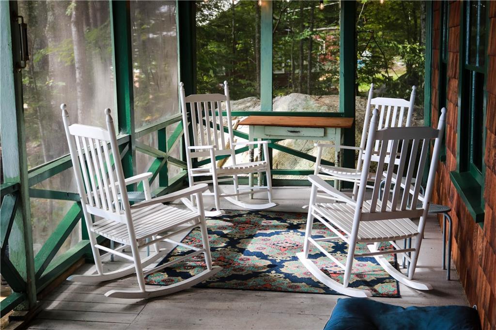 174 Safe Harbour Road Sebago, ME 04029 - Photo 26 of 35 Quaint sitting area on the porch....