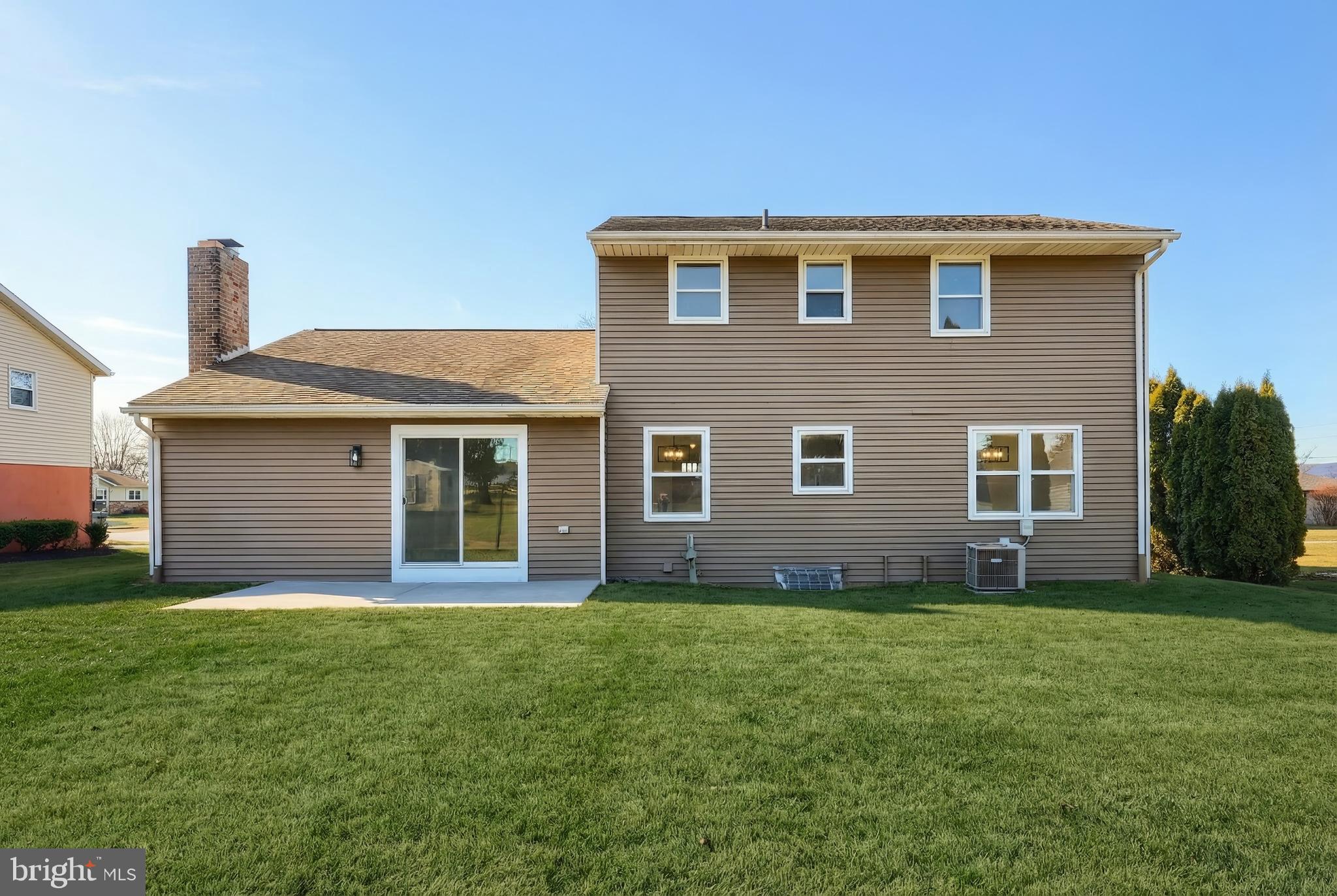 2510 Redwood Road Dover, PA 17315 - Photo 15 of 56 a front view of house with yard and trees in the background