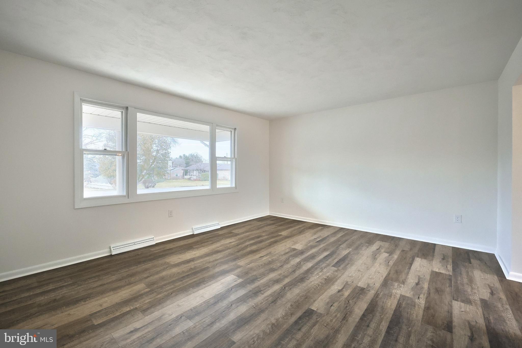 2510 Redwood Road Dover, PA 17315 - Photo 20 of 56 a view of an empty room with wooden floor and a window