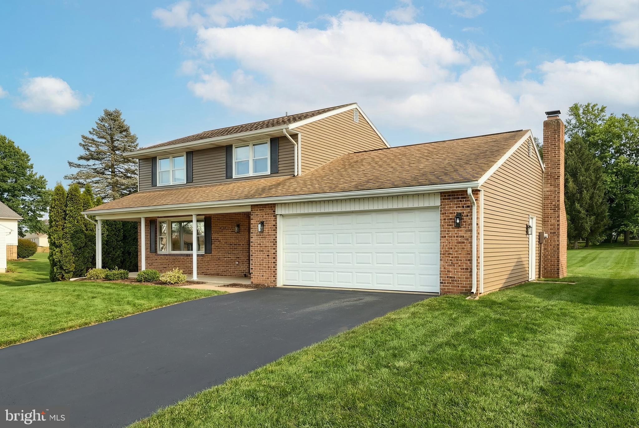 2510 Redwood Road Dover, PA 17315 - Photo 2 of 56 a front view of a house with a yard and garage