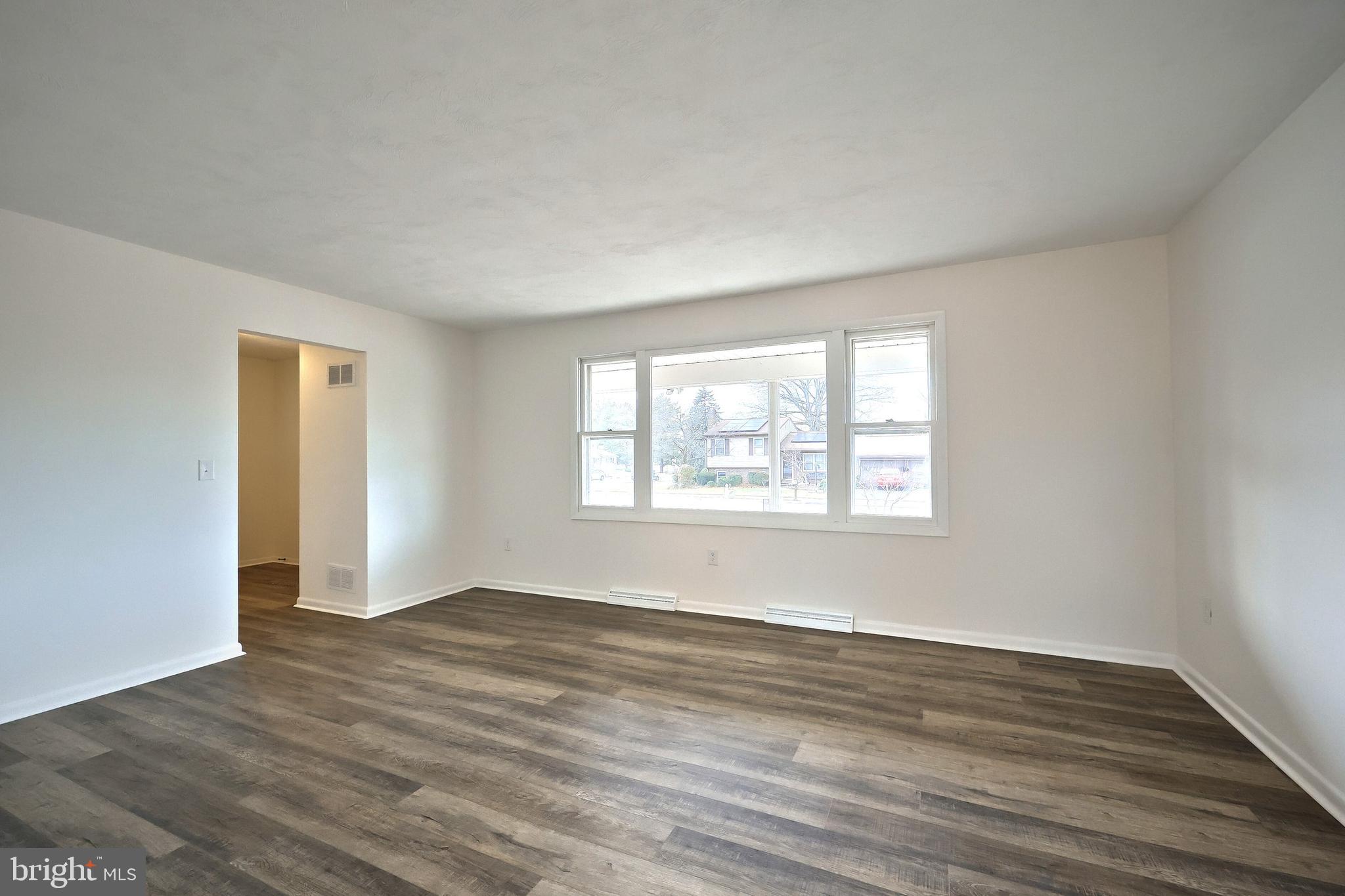 2510 Redwood Road Dover, PA 17315 - Photo 21 of 56 a view of an empty room with wooden floor and a window