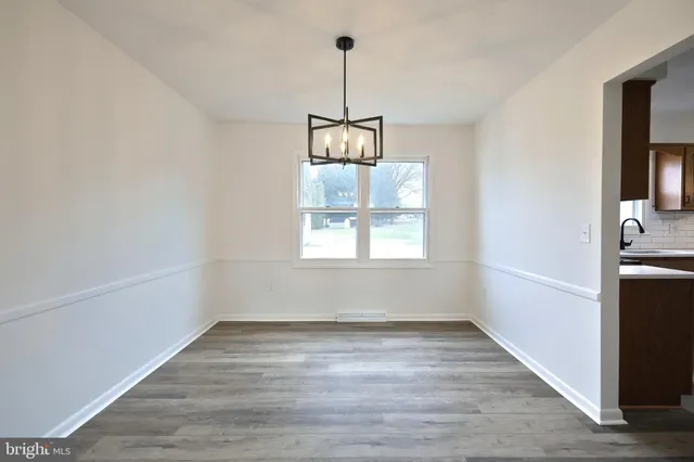 a kitchen with kitchen island a sink stainless steel appliances and cabinets