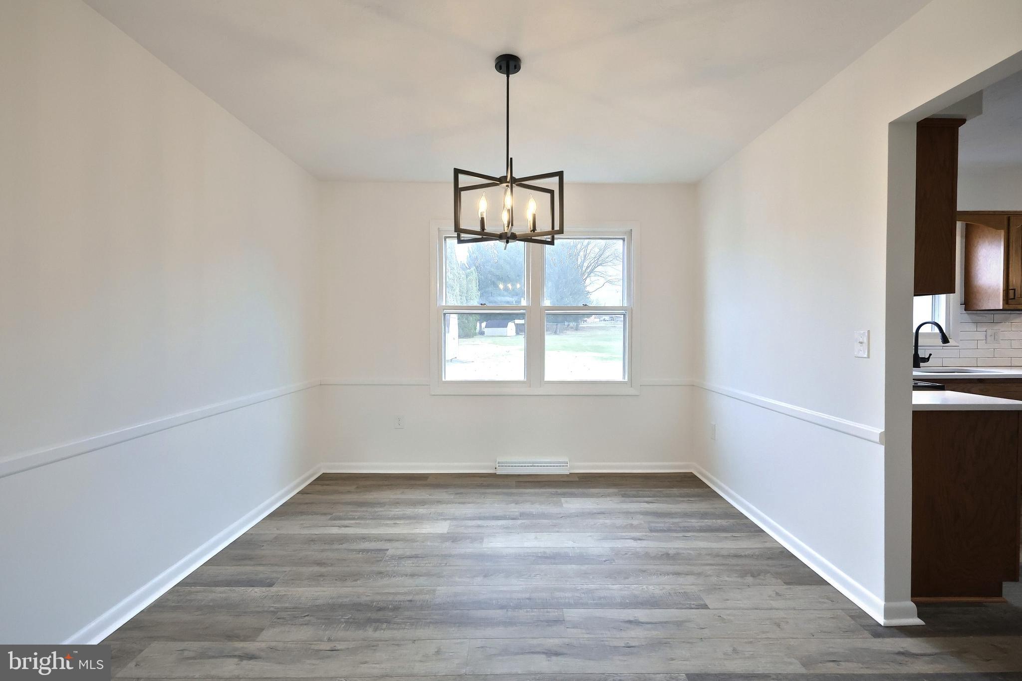2510 Redwood Road Dover, PA 17315 - Photo 23 of 56 a view of a room with window wooden floor and ceiling fan