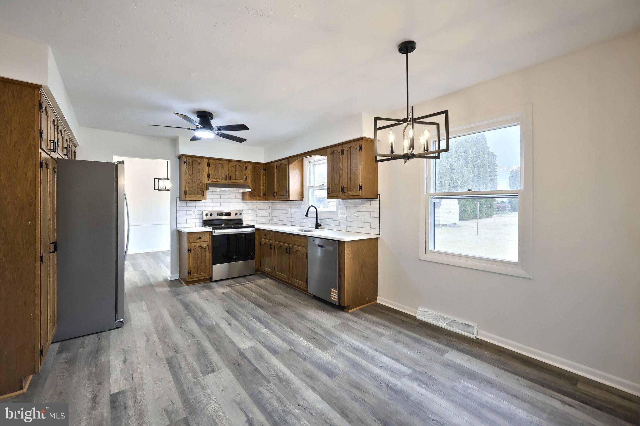 2510 Redwood Road Dover, PA 17315 - Photo 25 of 56 a kitchen with kitchen island a sink stainless steel appliances and cabinets