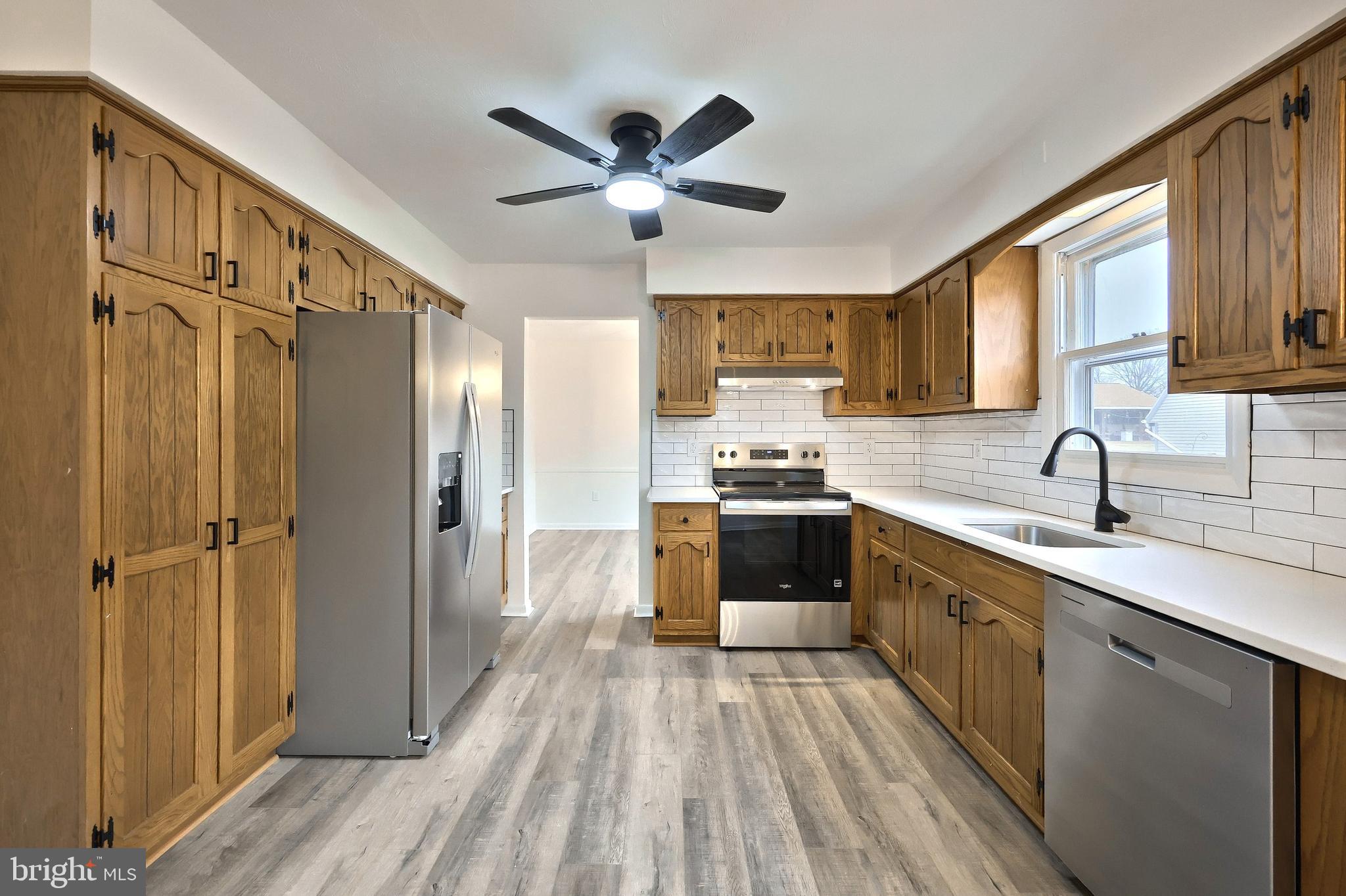 2510 Redwood Road Dover, PA 17315 - Photo 26 of 56 a kitchen with stainless steel appliances a refrigerator sink and cabinets