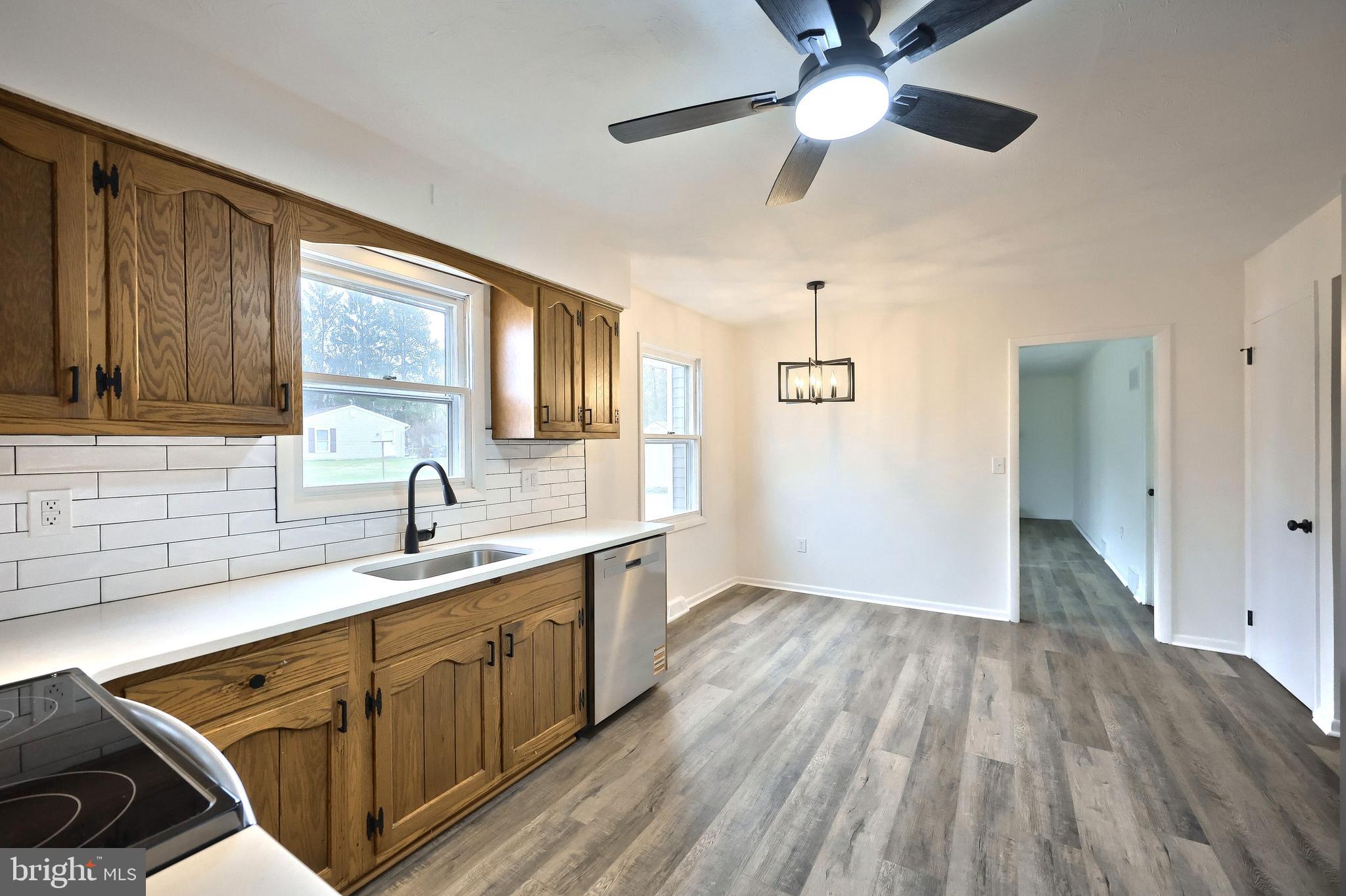 2510 Redwood Road Dover, PA 17315 - Photo 28 of 56 a kitchen with sink cabinets and wooden floor