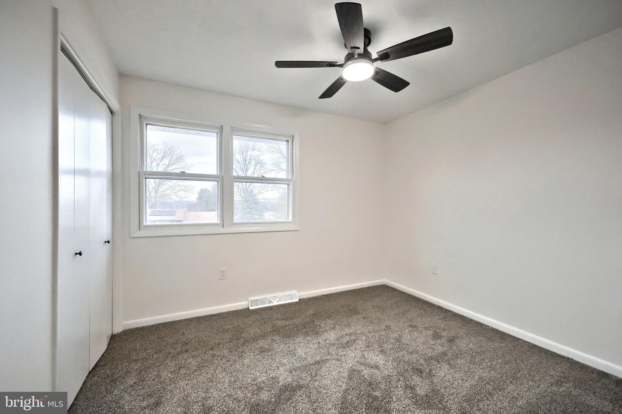 2510 Redwood Road Dover, PA 17315 - Photo 39 of 56 an empty room with a window and a fan