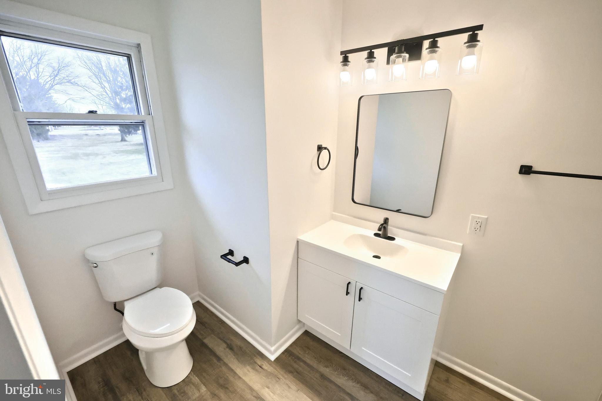 2510 Redwood Road Dover, PA 17315 - Photo 48 of 56 a bathroom with a toilet sink and mirror