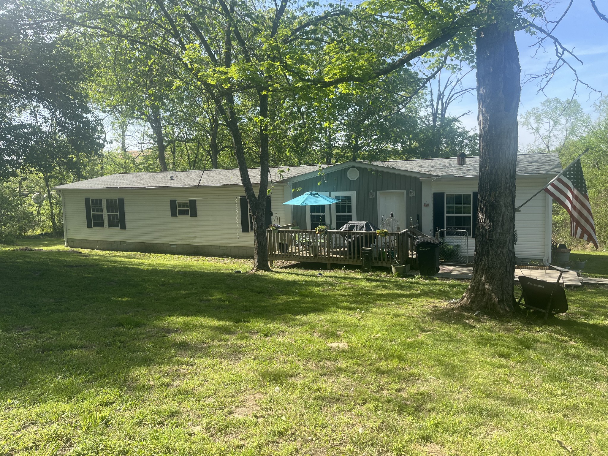 3390 Cainsville Road Lebanon, TN 37090 - Photo 1 of 5 a view of a house with a backyard porch and sitting area