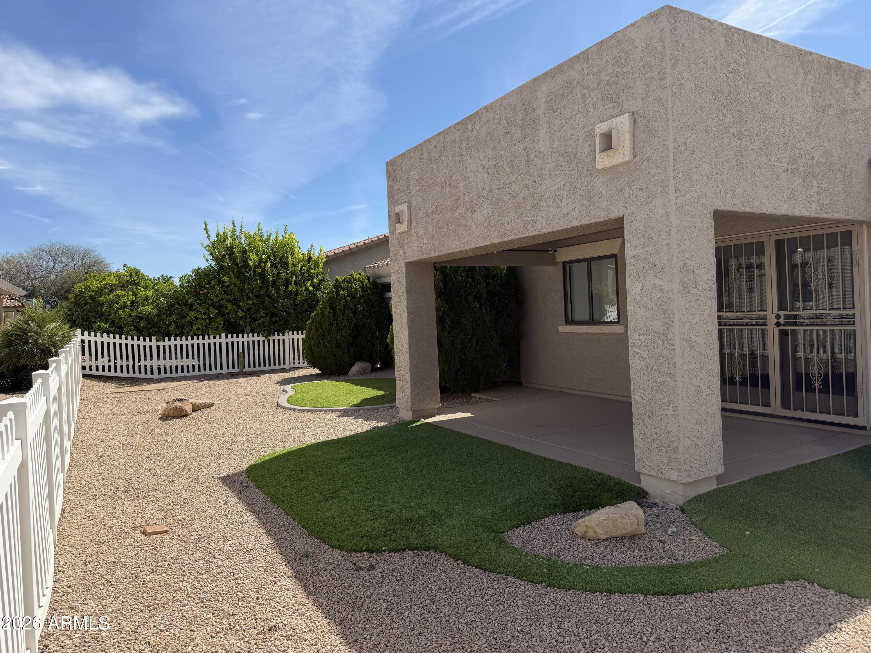 2101 South Meridian Road, Unit 255 Apache Junction, AZ 85120 - Photo 21 of 24 a view of a house with backyard and porch