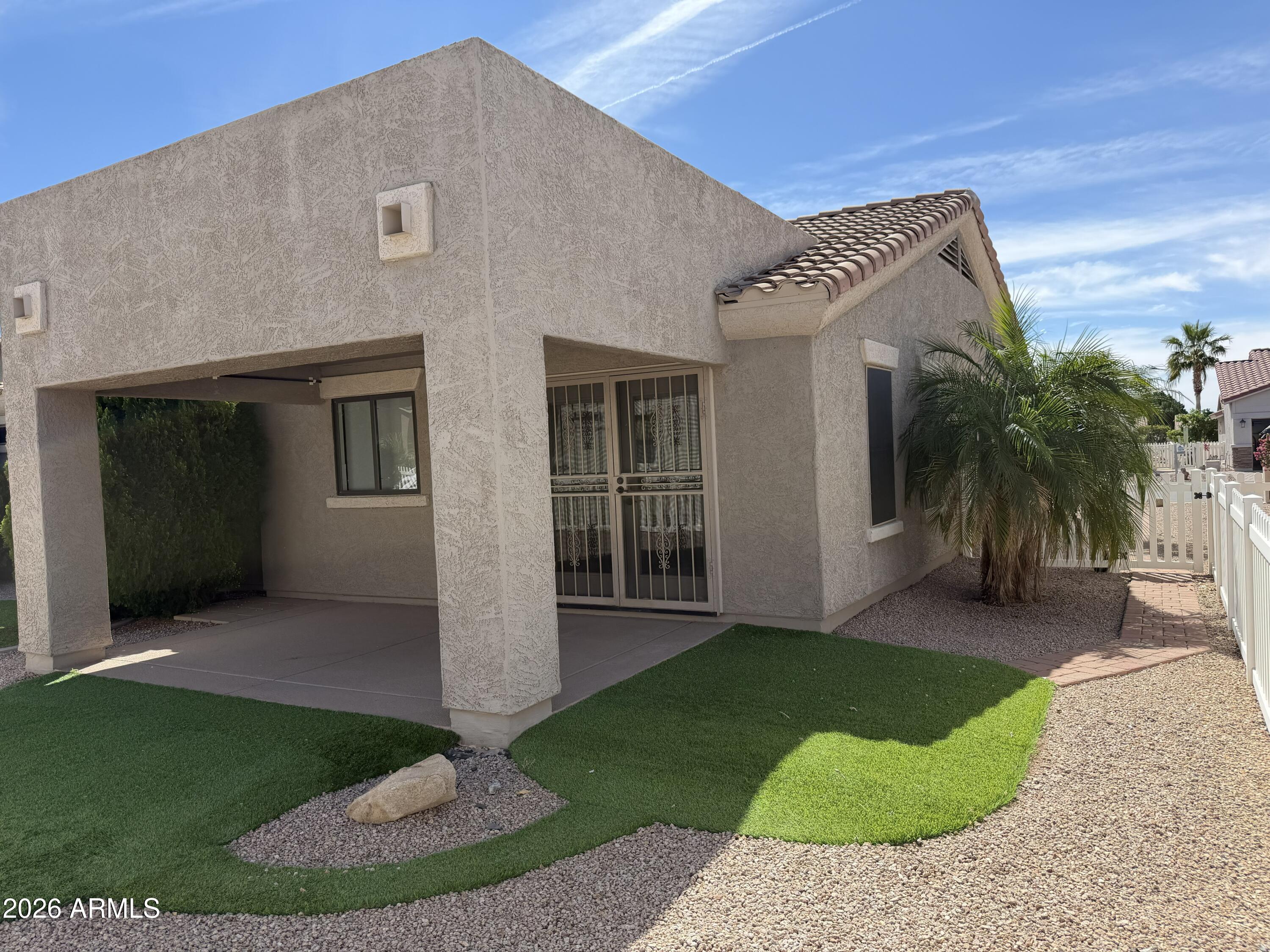 2101 South Meridian Road, Unit 255 Apache Junction, AZ 85120 - Photo 22 of 24 a view of a house with a yard and potted plants