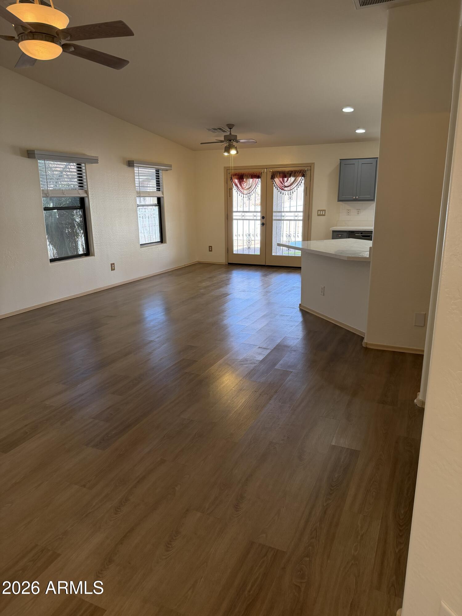2101 South Meridian Road, Unit 255 Apache Junction, AZ 85120 - Photo 3 of 24 wooden floor in an empty room with a window
