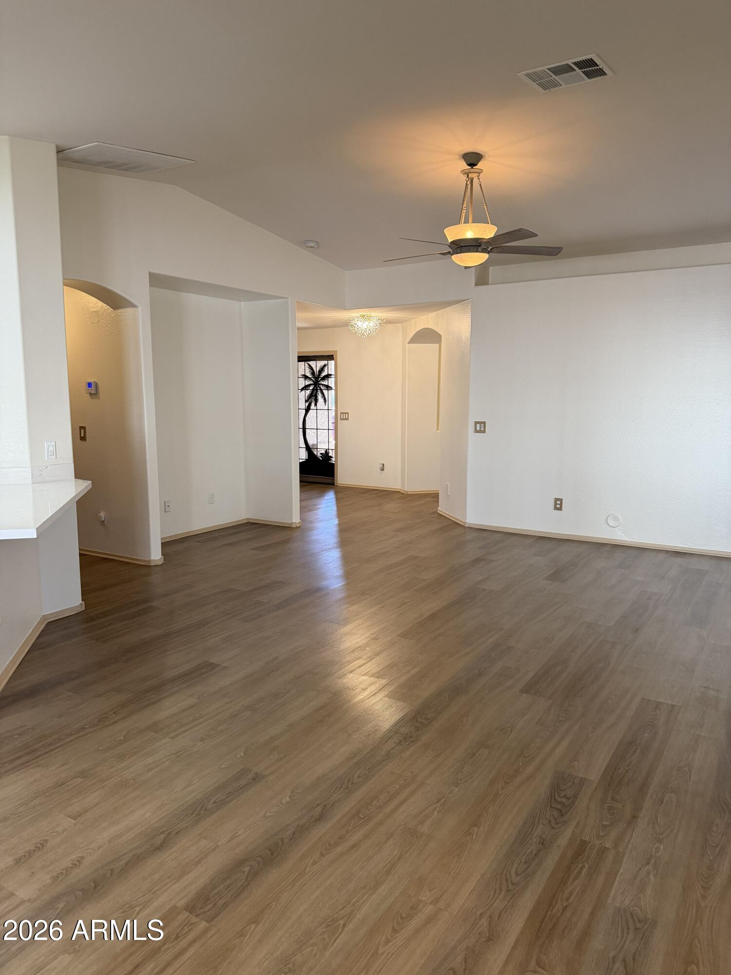 2101 South Meridian Road, Unit 255 Apache Junction, AZ 85120 - Photo 8 of 24 a view of empty room with wooden floor