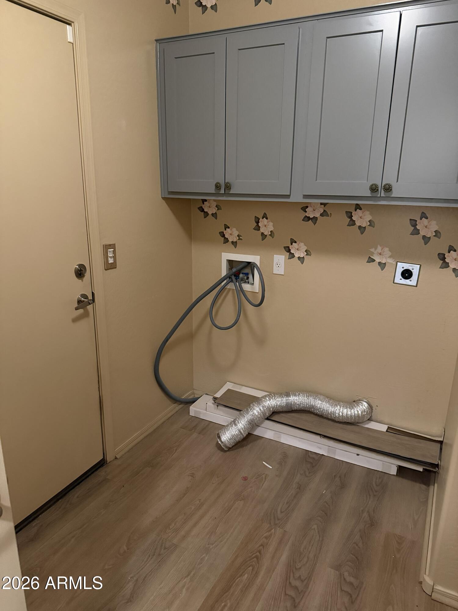 2101 South Meridian Road, Unit 255 Apache Junction, AZ 85120 - Photo 9 of 24 a view of a room with racks on the wall