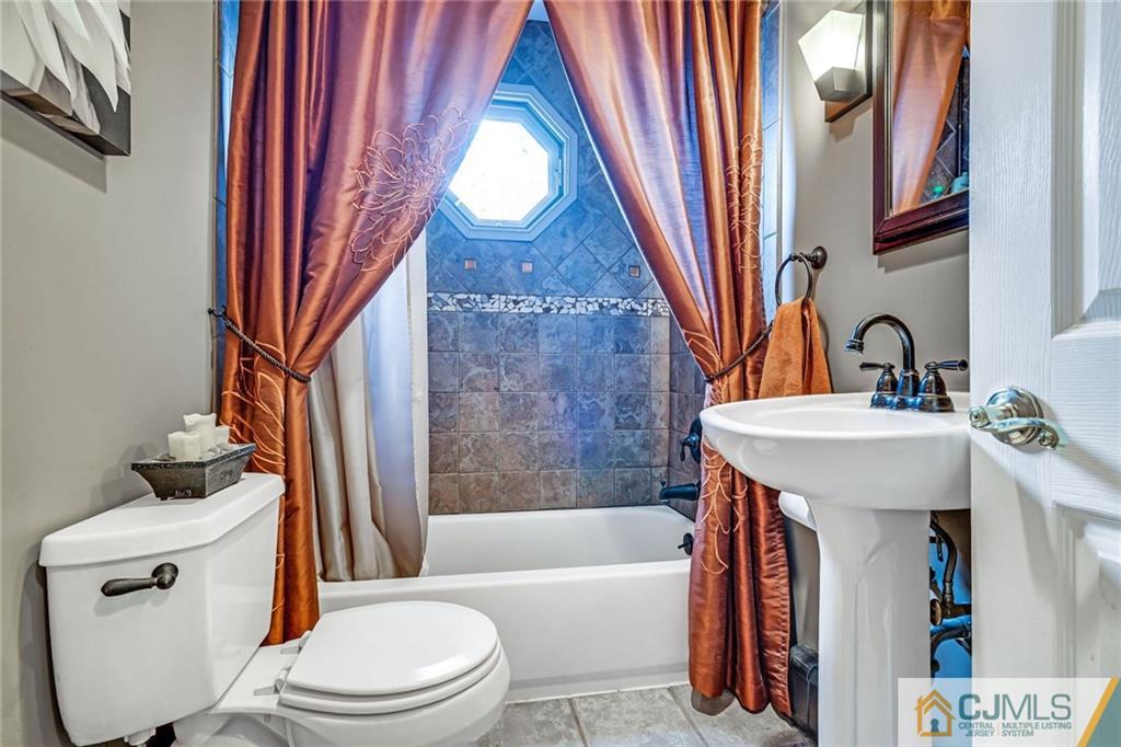 1612 Columbus Road Burlington, NJ 08016 - Photo 13 of 24 a bathroom with a sink toilet and shower