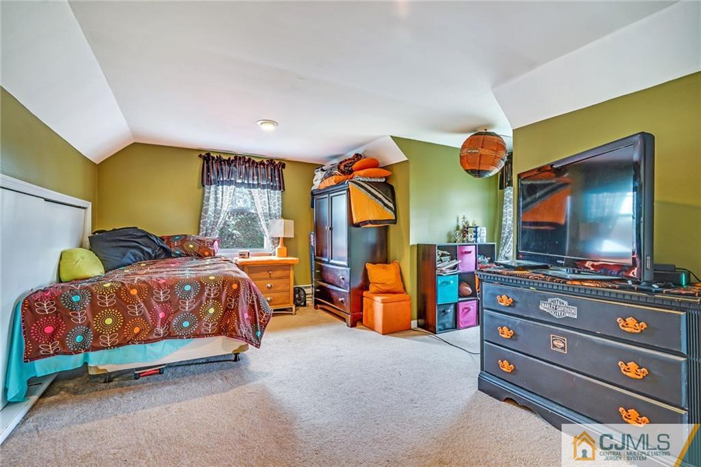 1612 Columbus Road Burlington, NJ 08016 - Photo 15 of 24 a bedroom with a bed and flat screen tv