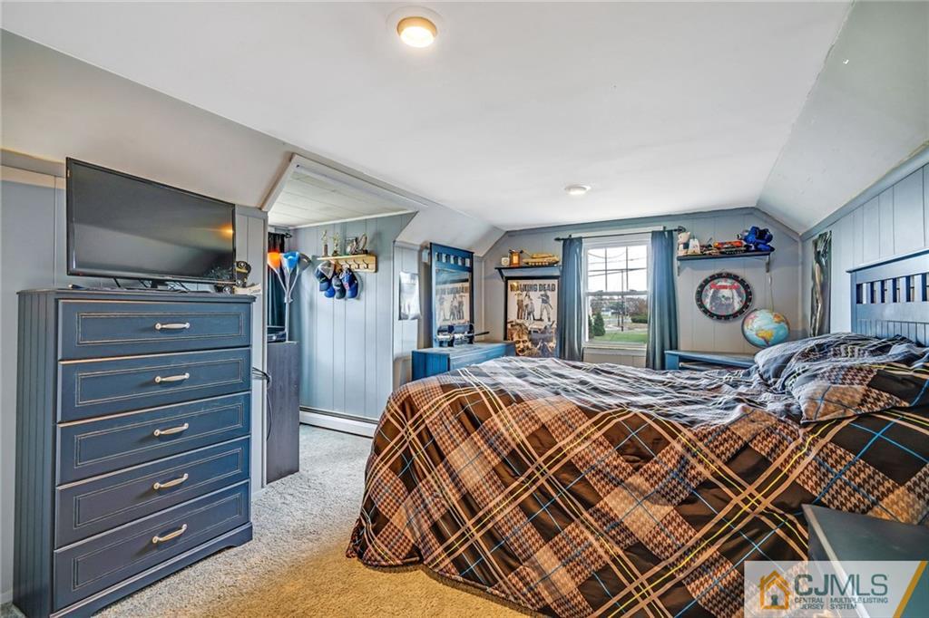 1612 Columbus Road Burlington, NJ 08016 - Photo 16 of 24 a bed room with a bed and a flat tv screen
