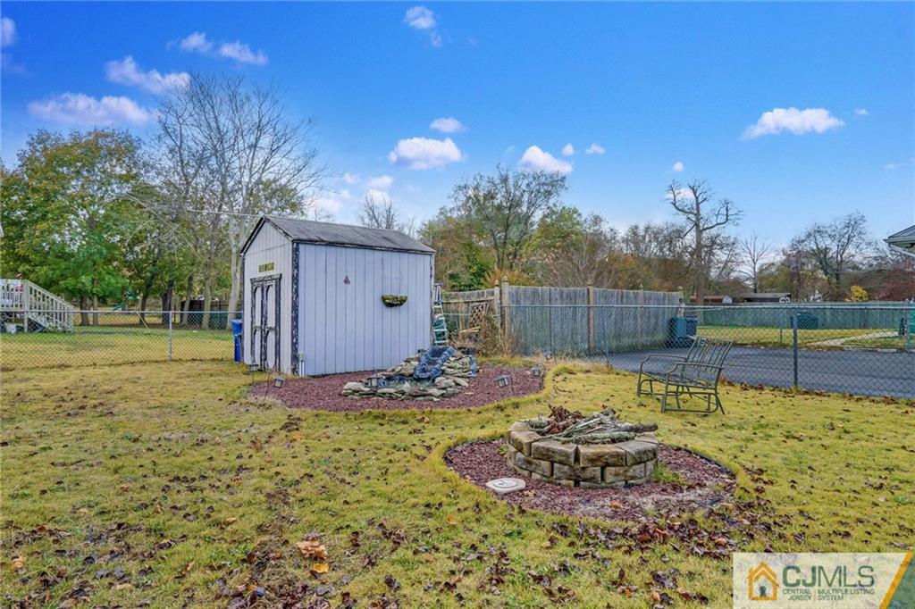 1612 Columbus Road Burlington, NJ 08016 - Photo 21 of 24 a view of a backyard with grass and a garden
