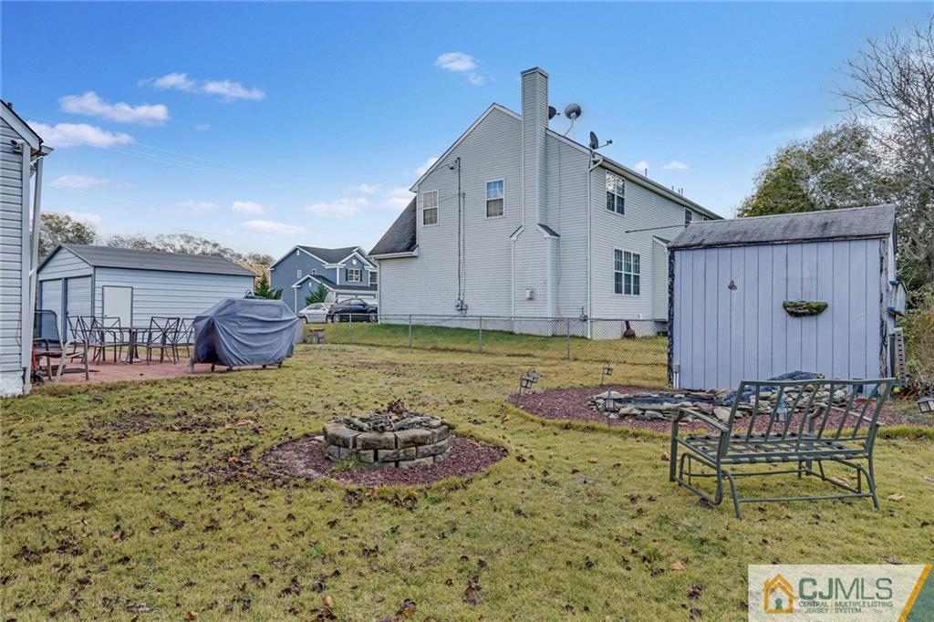 1612 Columbus Road Burlington, NJ 08016 - Photo 22 of 24 a view of a house with backyard and sitting area