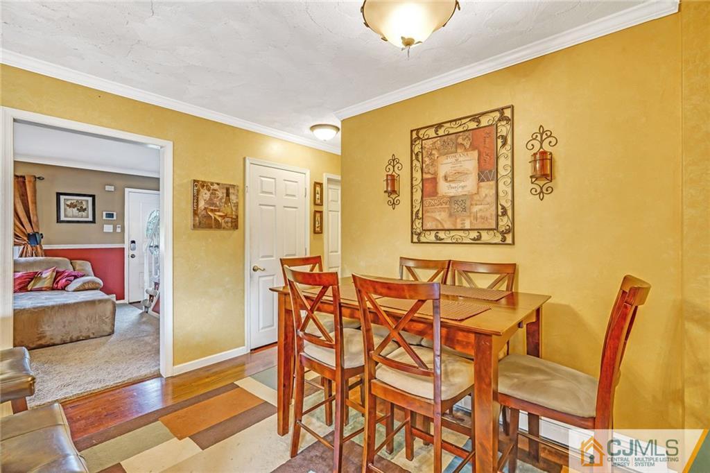 1612 Columbus Road Burlington, NJ 08016 - Photo 6 of 24 a view of a dining room with furniture and wooden floor