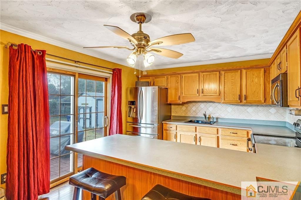 1612 Columbus Road Burlington, NJ 08016 - Photo 7 of 24 a kitchen with stainless steel appliances granite countertop a sink a stove and a refrigerator