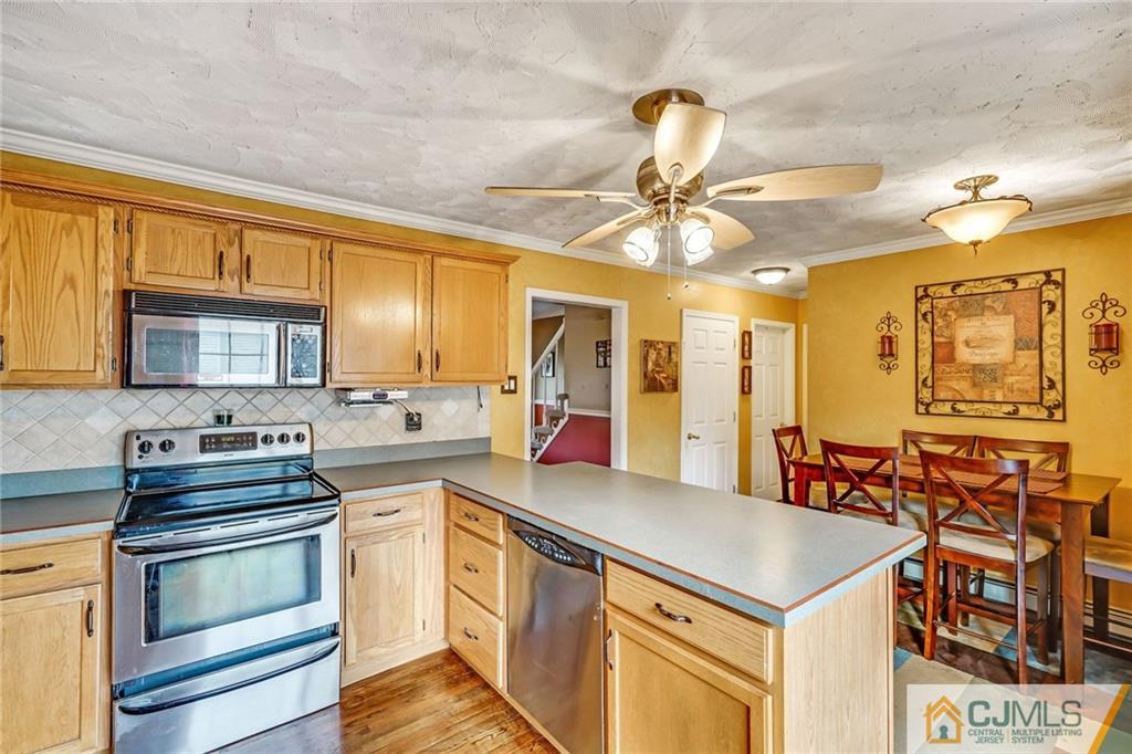 1612 Columbus Road Burlington, NJ 08016 - Photo 9 of 24 a kitchen that has a lot of cabinets a sink and appliances in it