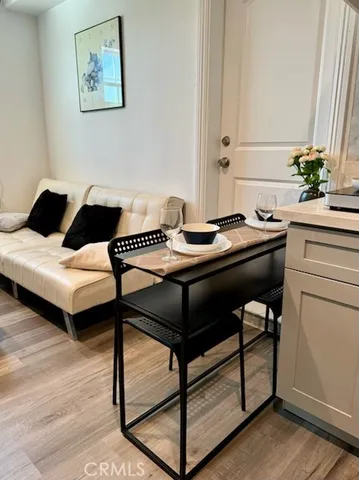 a reading room with furniture and a potted plant