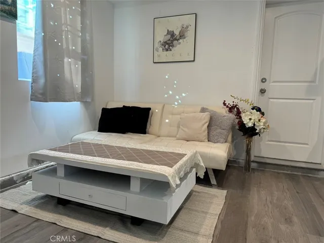 a bedroom with bed and window