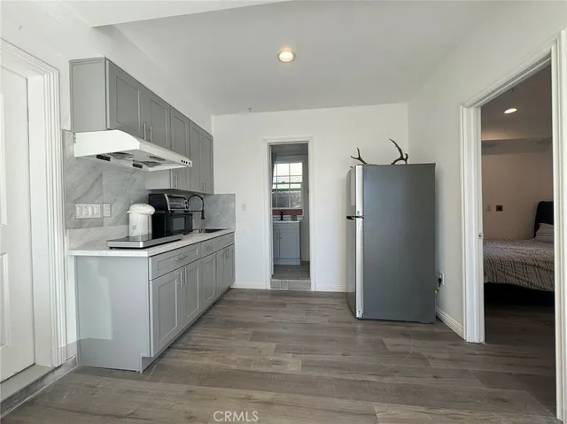 a kitchen with stainless steel appliances a refrigerator and a sink