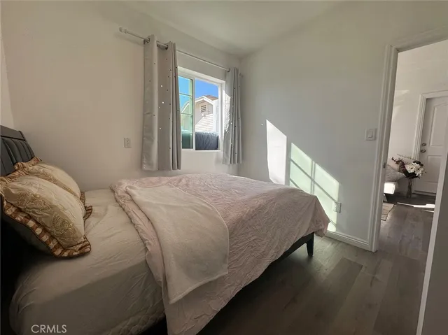 a bedroom with a bed and a view of bedroom