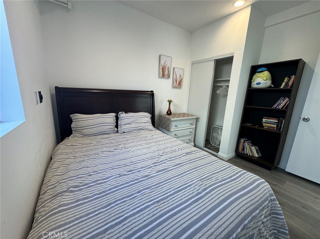 1700 South 8th Street Alhambra, CA 91803 - Photo 9 of 11 a bedroom with a bed and mirror