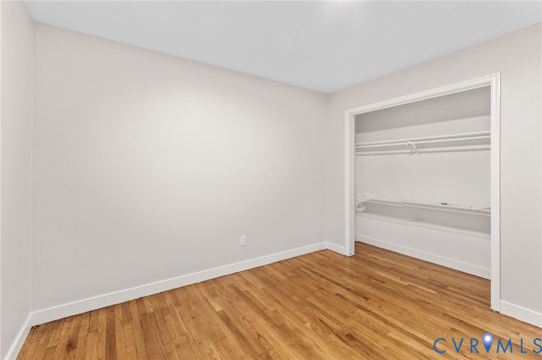 3151 Mountclair Road Chester, VA 23831 - Photo 29 of 36 Room featuring wood-finish flooring, white baseboa