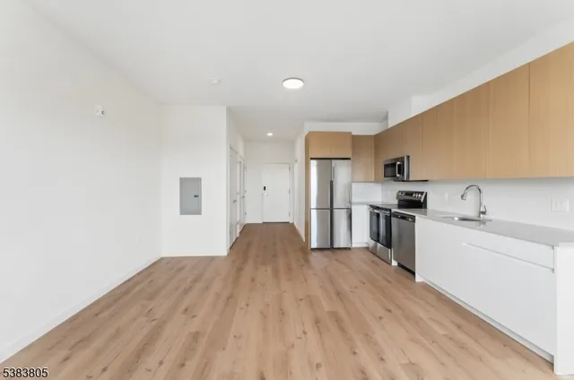 a view of kitchen with wooden floor