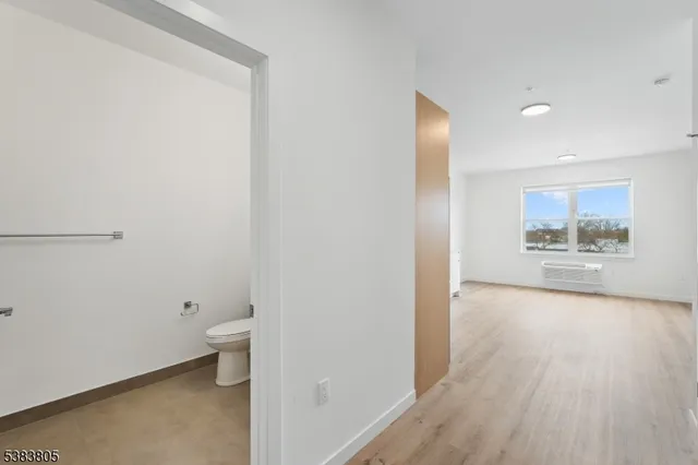 a view of an empty room and fire place