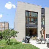 a view of two chairs in the patio