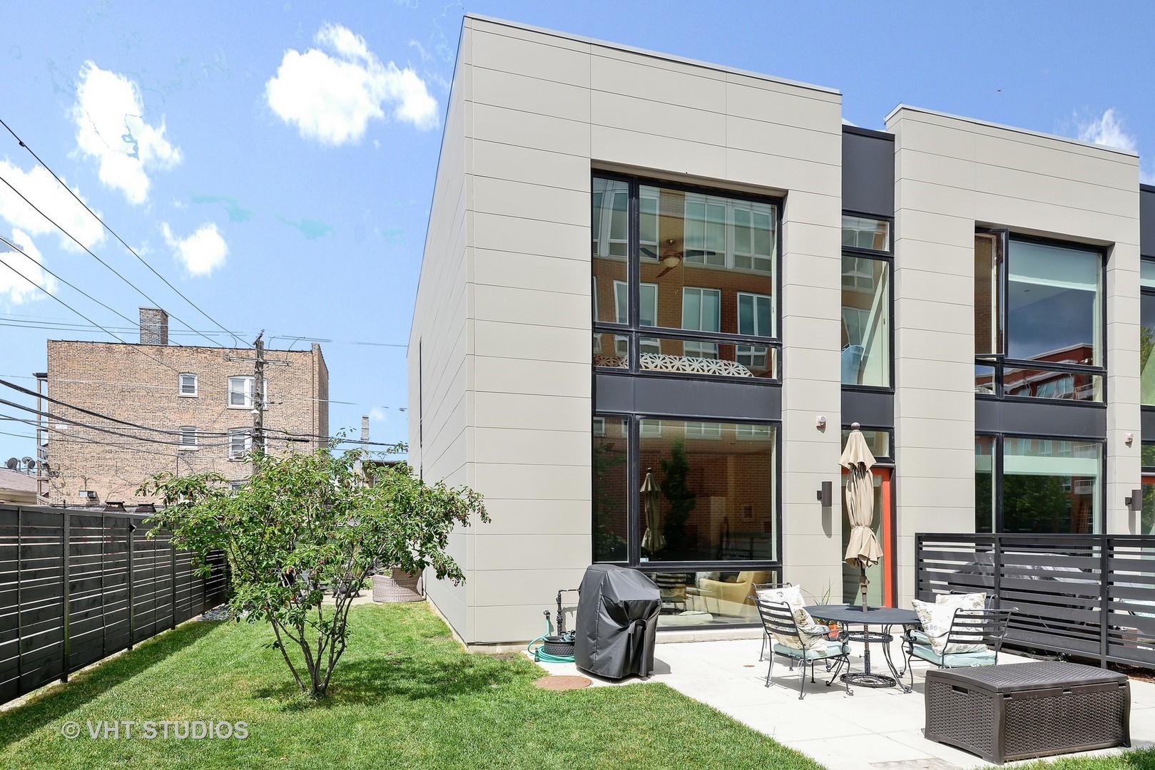 a view of two chairs in the patio