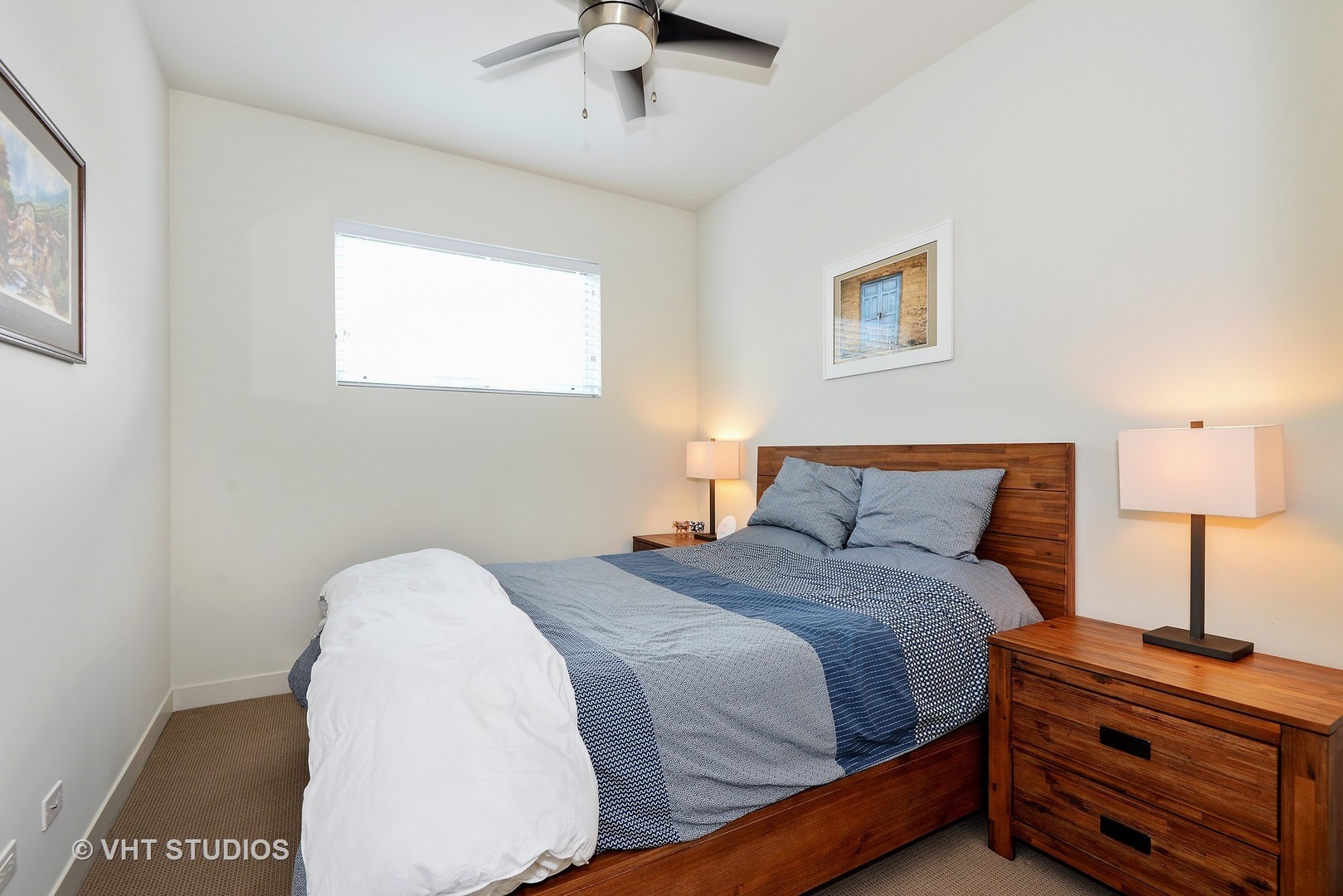 4832 North Clark Street, Unit 101 Chicago, IL 60640 - Photo 17 of 22 a bedroom with a bed and a night stand