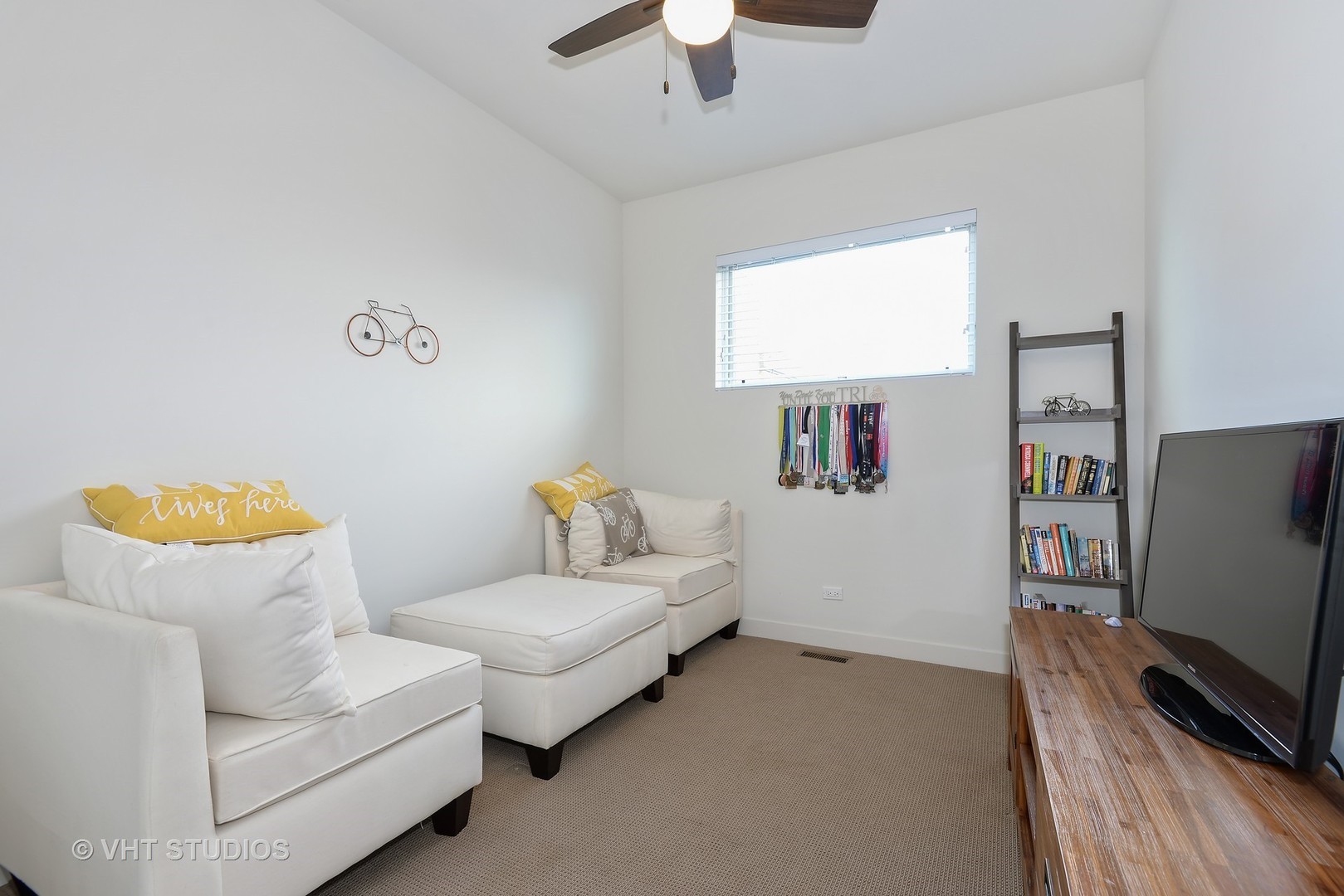 4832 North Clark Street, Unit 101 Chicago, IL 60640 - Photo 19 of 22 a living room with furniture and a flat screen tv