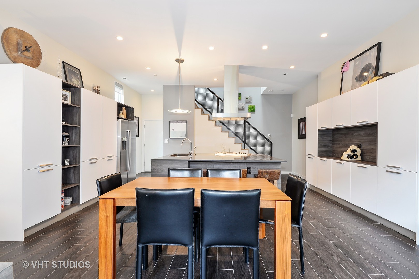 4832 North Clark Street, Unit 101 Chicago, IL 60640 - Photo 2 of 22 a dining room with furniture and wooden floor