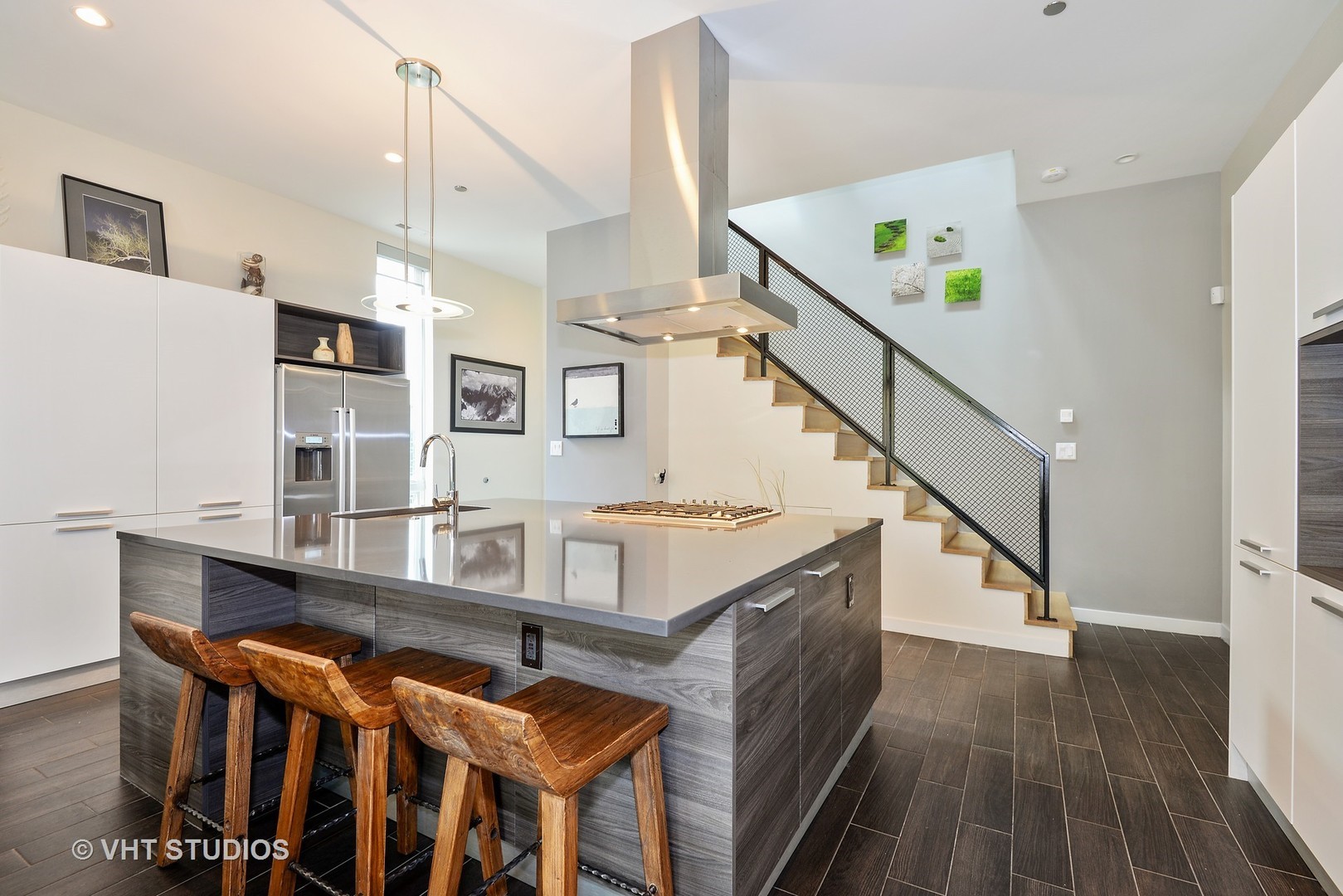 4832 North Clark Street, Unit 101 Chicago, IL 60640 - Photo 5 of 22 a view of kitchen and hall with wooden floor