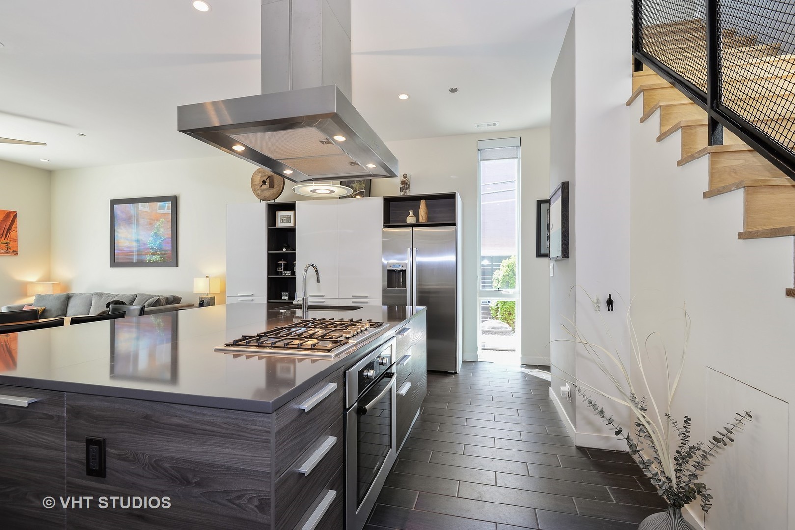 4832 North Clark Street, Unit 101 Chicago, IL 60640 - Photo 6 of 22 a kitchen with stainless steel appliances granite countertop a stove and a refrigerator