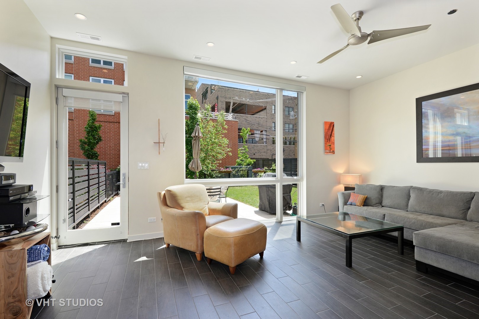 4832 North Clark Street, Unit 101 Chicago, IL 60640 - Photo 10 of 22 a living room with furniture and a large window
